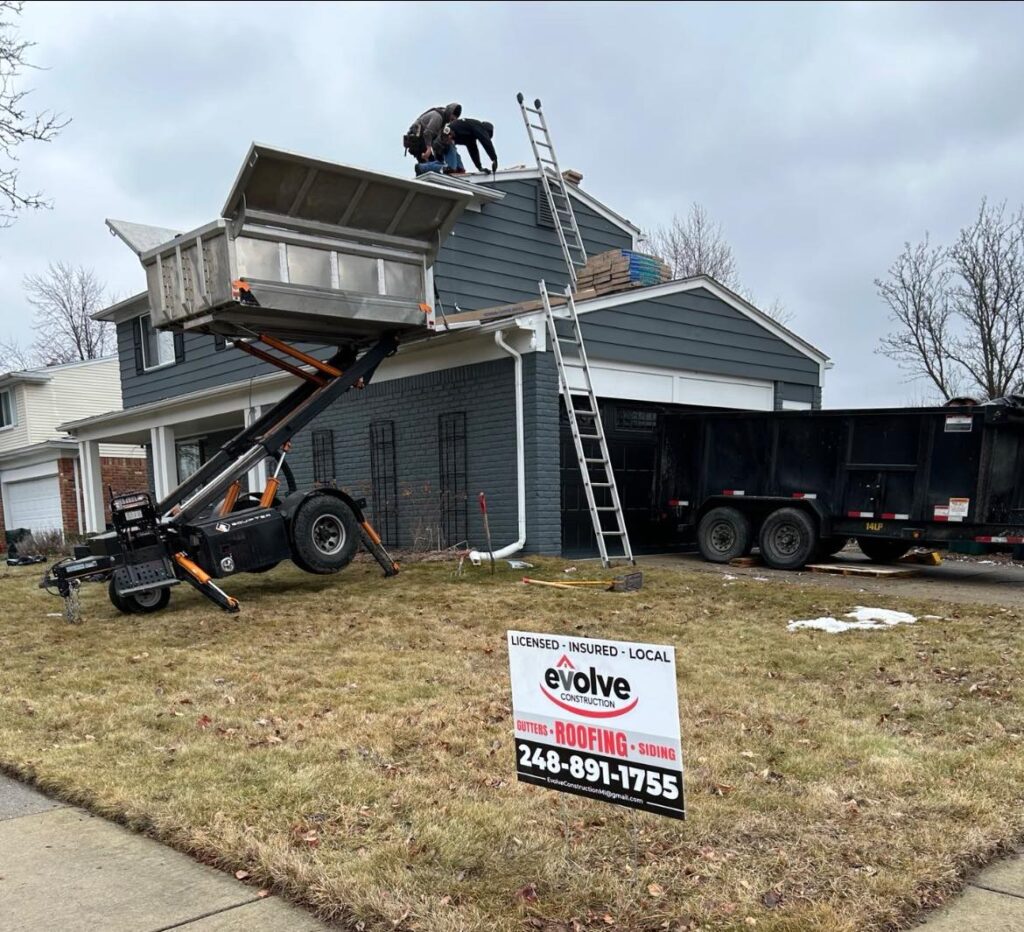Evolve Roofing installing a new roof in Macomb County MI on a house.